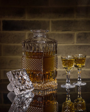Crystal decanter of whisky and two glasses