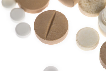 Stack of different pills isolated on white background