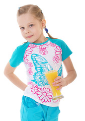 Obraz premium Cute little girl drinks orange juice