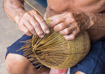 Male hands are creating a fishtrap