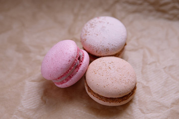 three macaroons on craft paper