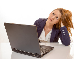 young woman is stressed due to computer failure - 63838956