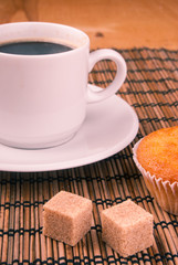 espresso coffee in a white china cup over wood surface