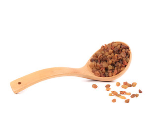 Wooden spoon with raisins.