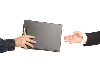 Hand giving a folder.