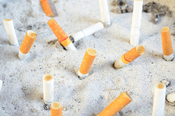 cigarette stub in the sand