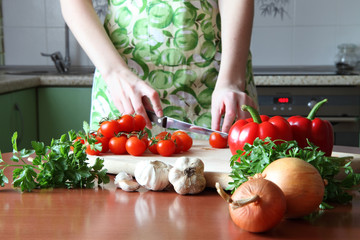female decorating food in kitchen