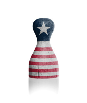 Wooden pawn with a flag painting