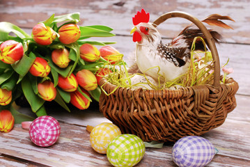 wicker basket with rooster and eggs for easter