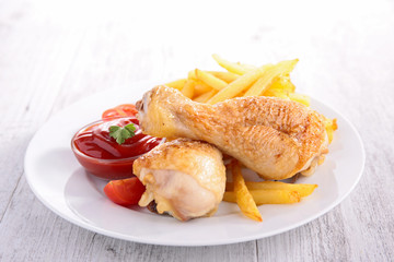 grilled chicken leg and fries