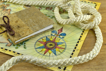 Book with rope and map
