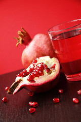 Fresh ripe pomegranate and juice in the glass