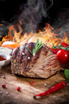 Beef steak on wooden table