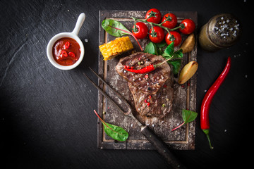 Fototapeta na wymiar Beef steak on wooden table