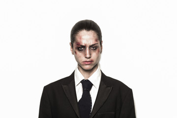 Beaten up girl wearing coat and tie