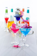 Blue swimming pool Cocktail with caviar and flower petals