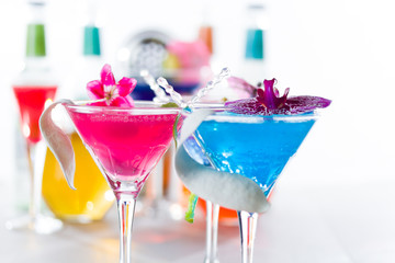 Blue swimming pool Cocktail with caviar and flower petals