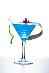 Blue swimming pool Cocktail with caviar and flower petals