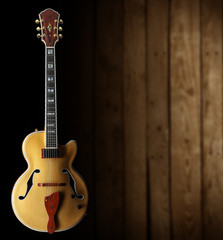 Obraz na płótnie Canvas jazz guitar on dark wooden background