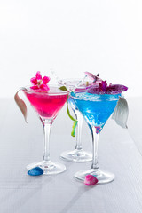 Blue swimming pool Cocktail with caviar and flower petals