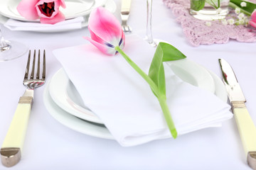 Table setting with spring flowers close up