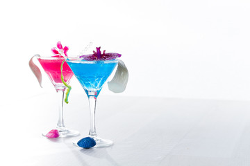 Blue swimming pool Cocktail with caviar and flower petals