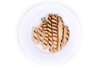 Grilled chicken breast on plate.