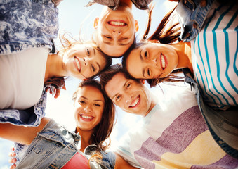 group of teenagers looking down