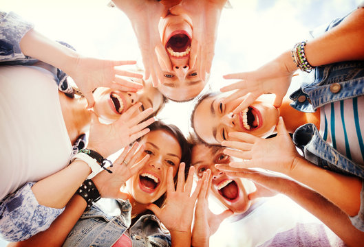 Group Of Teenagers Looking Down And Screaming