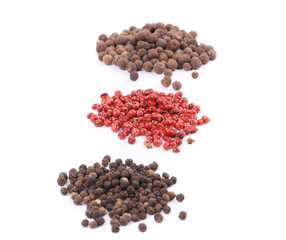 Various peppercorn heaps.