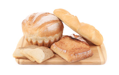 Various types of bread on cutting board.