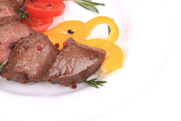 Beefsteaks with tomatoes and rosemary.