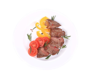 Beefsteaks with tomatoes and rosemary.