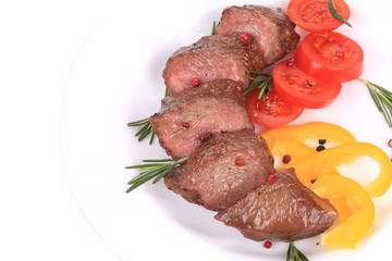 Beefsteaks with tomatoes and rosemary.