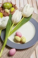 Fototapeta na wymiar Easter table setting with tulips and eggs