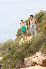 Couple on a hiking day by the sea
