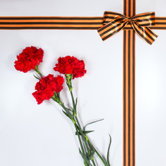Red carnations tied Georgievsky tape