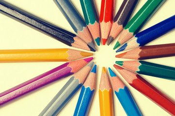 Color pencils on light yellow background