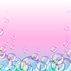 Glossy bubbles on pink and green background.