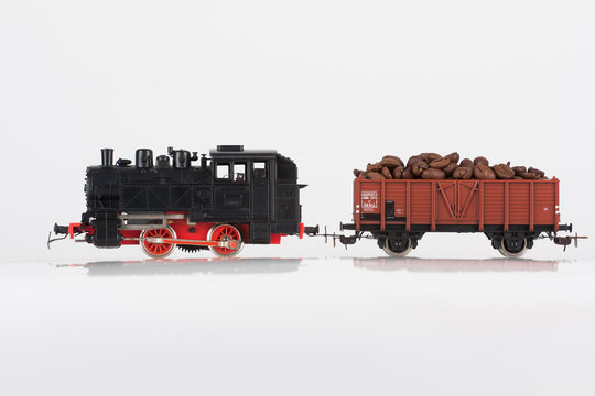 toy black locomotive and coffee