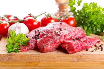 raw meat with herbs and vegetables