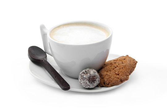 cup of coffee with chocolate candy, cookies and chocolate coffee