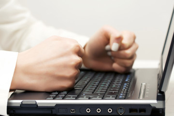 Female hands on the laptop