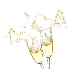 Glasses of champagne with splash, isolated on white © Africa Studio