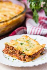 Homemade lasagna with Bolognese meat sauce Bechamel, serving
