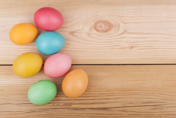 Obraz na płótnie Canvas Easter eggs on wooden background.