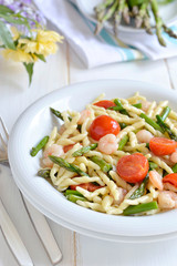 Pasta with asparagus and shrimp. Italian food. Close-up.