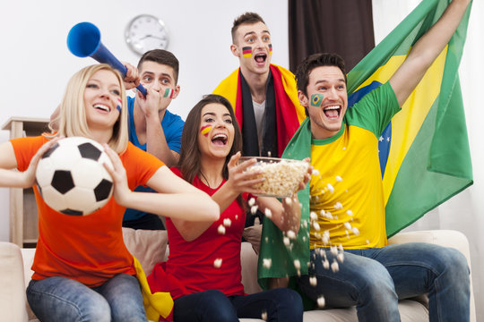 Friends of different nations celebrating goal
