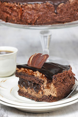 Chocolate cake on wooden background. Copy space