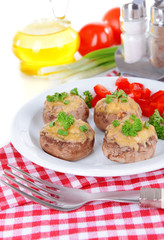 Stuffed mushrooms on plate on table close-up
